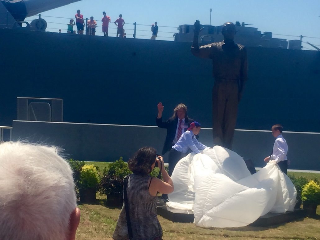 Dr. Barry Booth unveiling "The Recruit" statue by Casey Downing. It is at the USS Alabama.